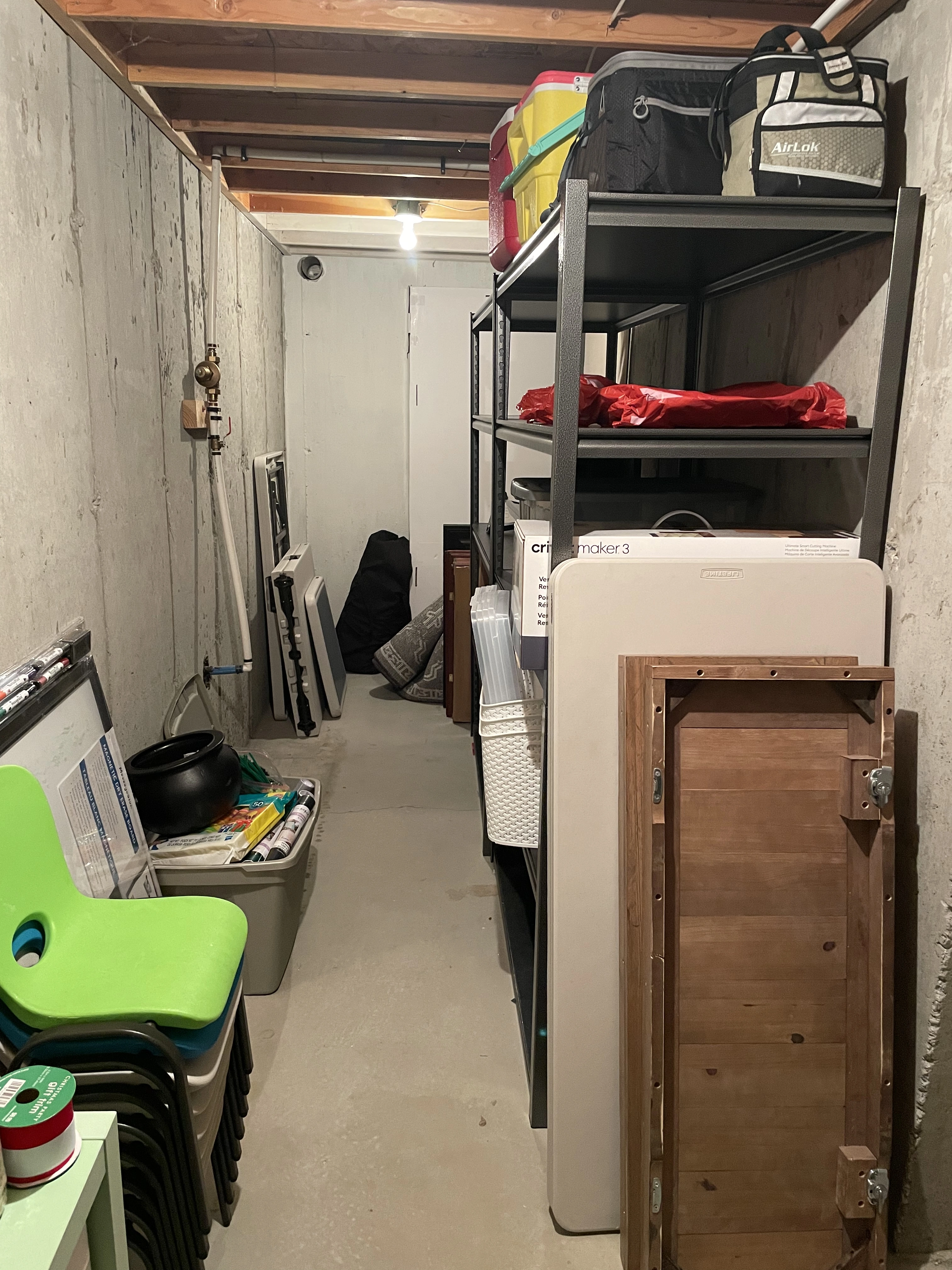 The same storage room with items sorted onto shelves after ModJobs organizing